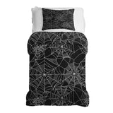 Therapy blanket bedding set, black with spiderweb pattern.