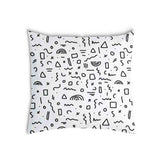 White health pillow with black shapes.