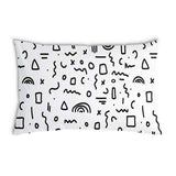 White health pillow with black shapes.