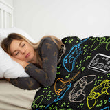 Therapy blanket bedding set, black, with game consoles.