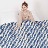 Therapy blanket and bedding set with blue dots.