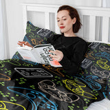 Therapy blanket bedding set, black, with game consoles.