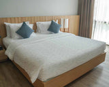 Therapy blanket and bedding set with delicate leaves.