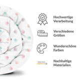 Therapy blanket and bedding set, white with colorful paws.