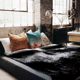 Therapy blanket bedding set, black with mottled pattern.