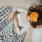 Therapy blanket and bedding set with black shapes.