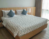 Therapy blanket and bedding set with black stripes.