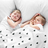 Therapy blanket bedding set, white with black triangles.