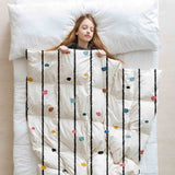Therapy blanket and bedding set with colorful dots.