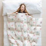 Therapy blanket and bedding set, white with colorful paws.