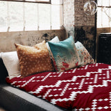 Therapy blanket and bedding set with red Christmas pattern.