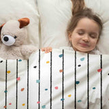 Therapy blanket and bedding set with colorful dots.