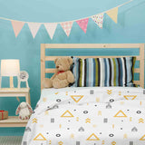 Therapy blanket and bedding set, white with yellow triangles.
