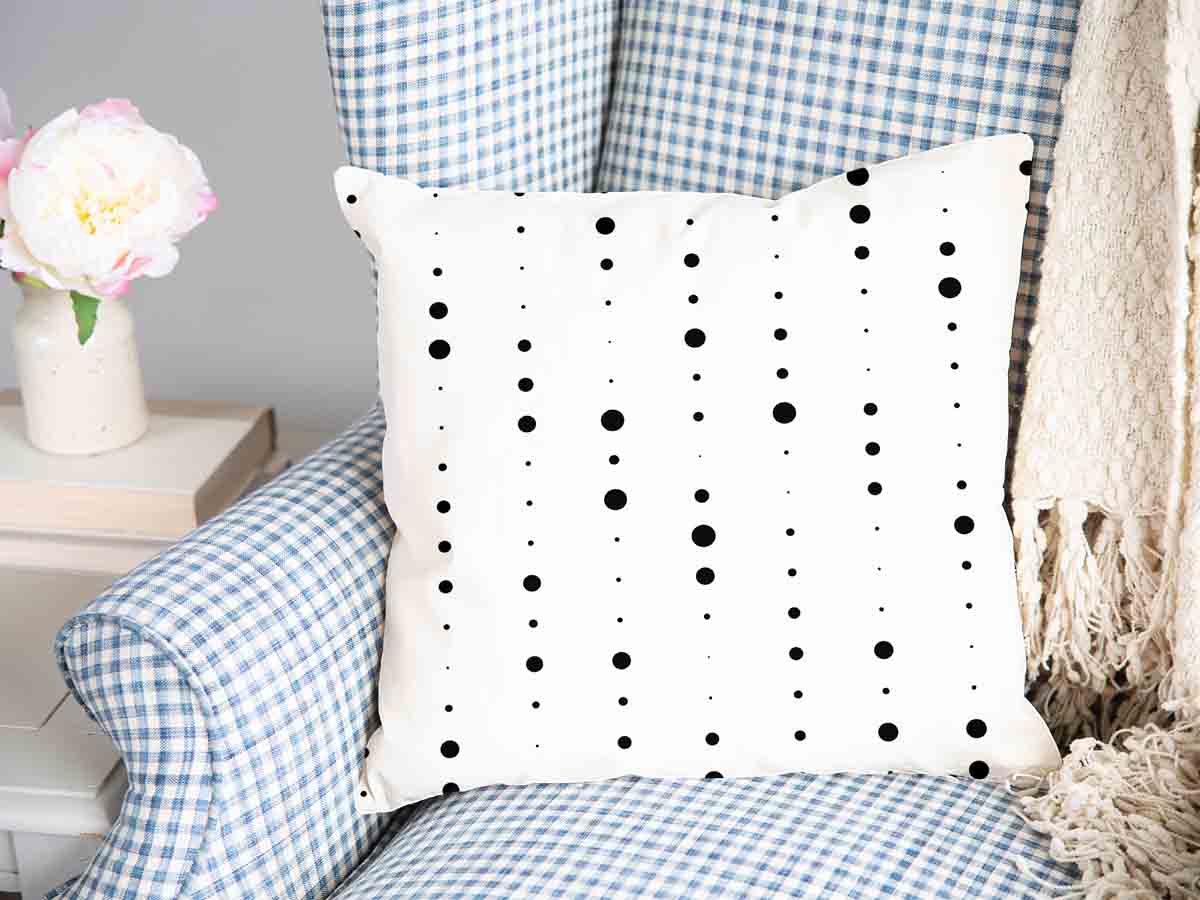 Coussin de santé blanc avec des points noirs