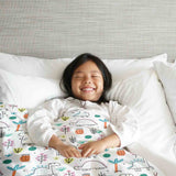 Therapy blanket and bedding set with colorful dinosaurs