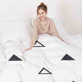 Therapy blanket and bedding set, white with black triangles.