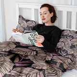 Therapy blanket and bedding set, black with purple leaves.