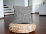 Health pillow, grey with white palm leaves.