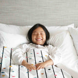 Therapy blanket and bedding set with colorful dots.