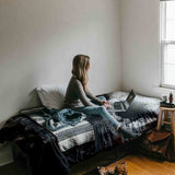 Therapy blanket bedding set, black with mottled pattern.