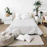 Therapy blanket bedding set with black pattern.