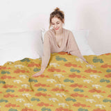 Therapy blanket and bedding set, orange with tractors.