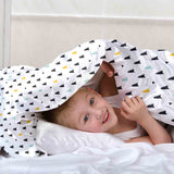 Therapy blanket and bedding set with small fir trees.