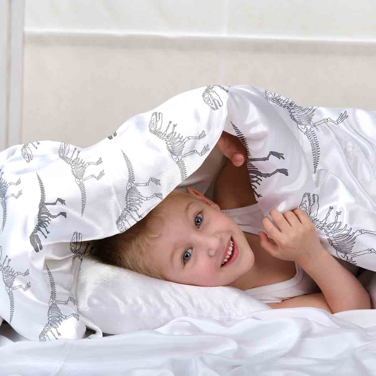 Ensemble de literie avec couverture thérapeutique blanc avec squelette de dinosaure