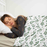 Therapy blanket bedding set, white with eucalyptus branches.