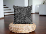 Health pillow, black with spiderweb pattern.