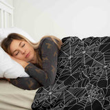 Therapy blanket bedding set, black with spiderweb pattern.