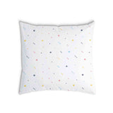 White health pillow with colorful shapes