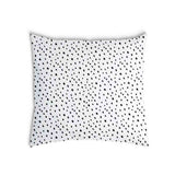 White health pillow with many small dots.