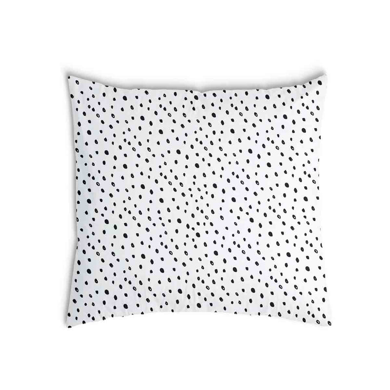 White health pillow with many small dots.