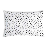 White health pillow with many small dots.