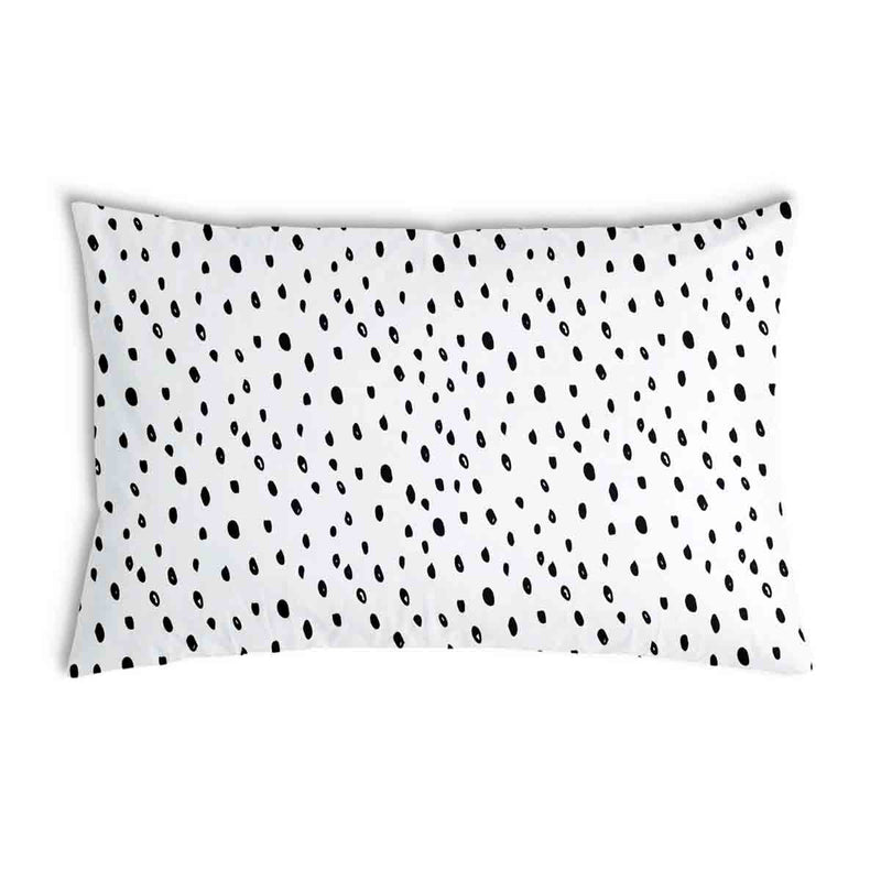 White health pillow with many small dots.