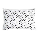 White health pillow with many small dots.