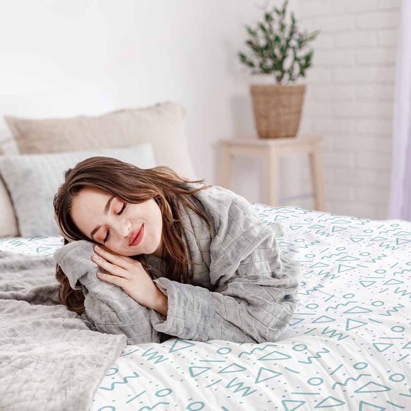 Therapy blanket and bedding set, white with blue shapes.