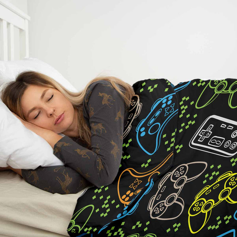 Therapy blanket bedding set, black, with game consoles.
