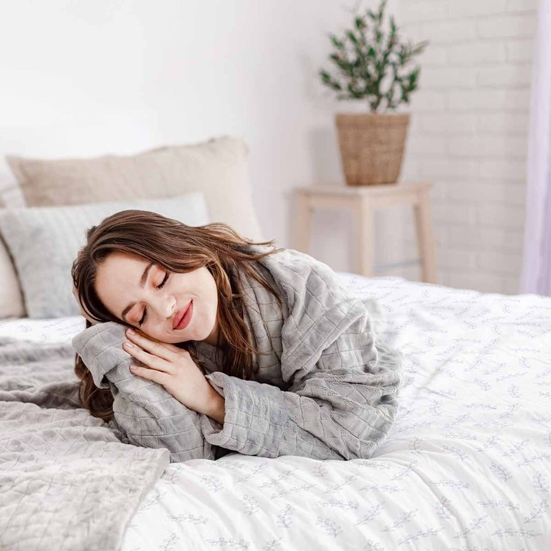 Therapy blanket and bedding set with delicate leaves.