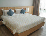 Therapy blanket and bedding set with orange circles.