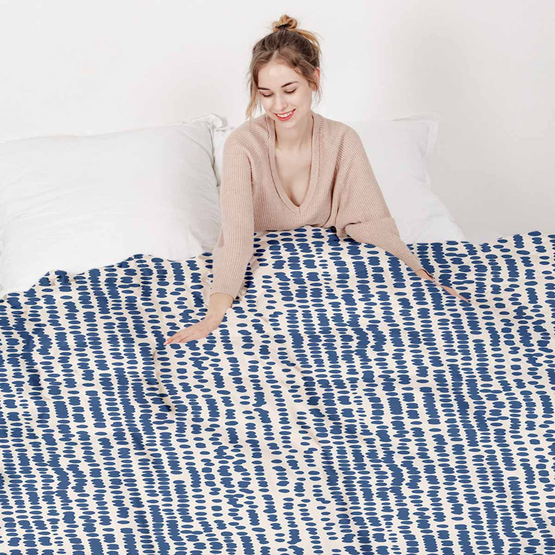 Therapy blanket and bedding set with blue dots.