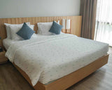 Therapy blanket and bedding set, white with grey dots.