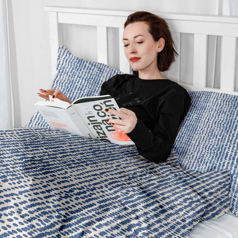 Therapy blanket and bedding set with blue dots.