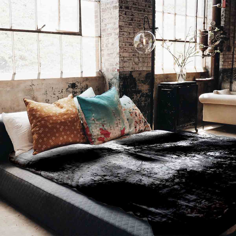 Therapy blanket bedding set, black with mottled pattern.