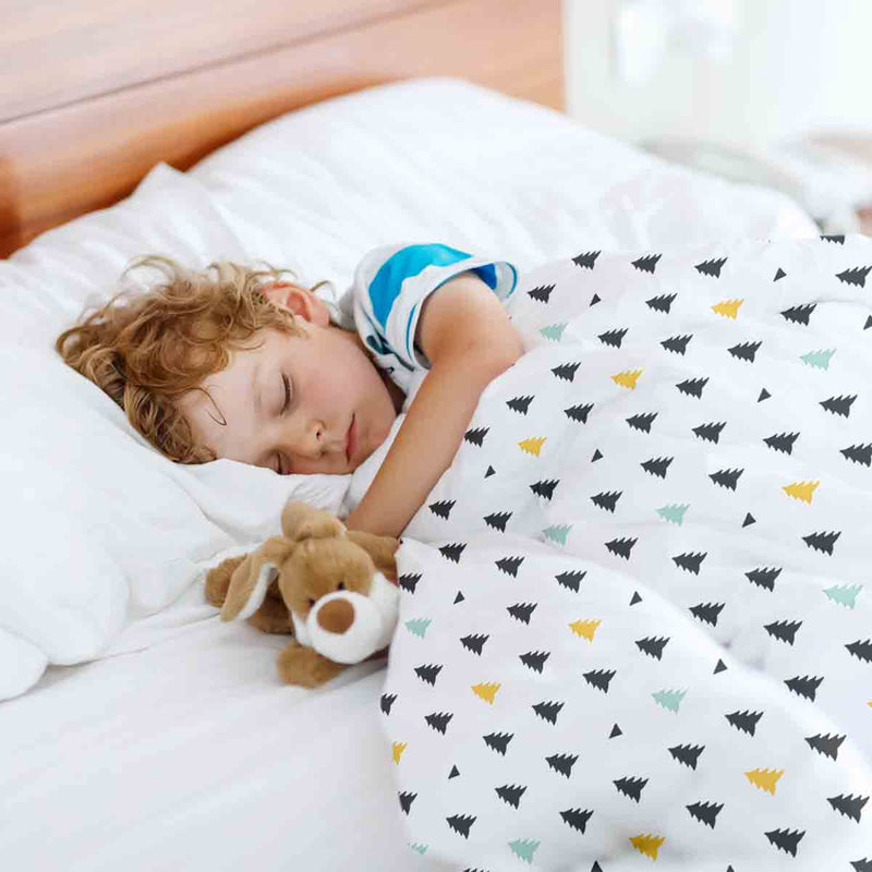 Therapy blanket and bedding set with small fir trees.