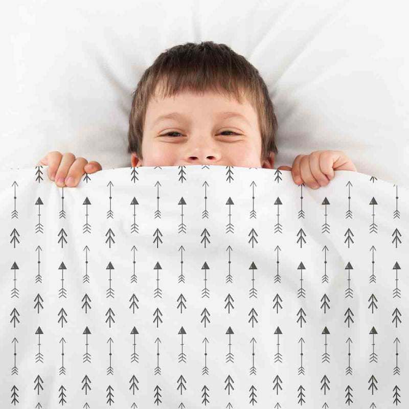 Therapy blanket and bedding set, white with many black arrows.