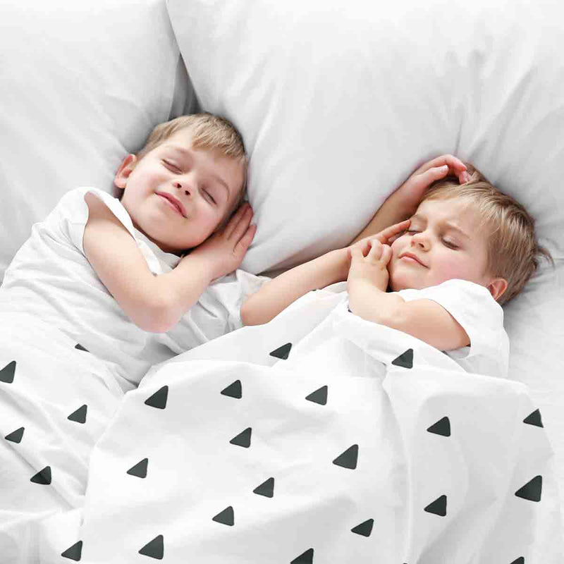 Therapy blanket bedding set, white with black triangles.