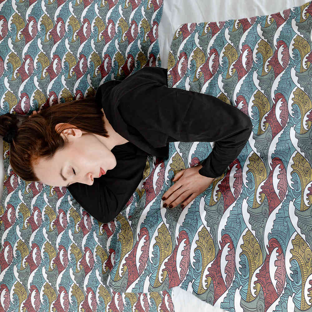 Ensemble de linge de lit avec couvertures thérapeutiques motifs brise-lames colorés