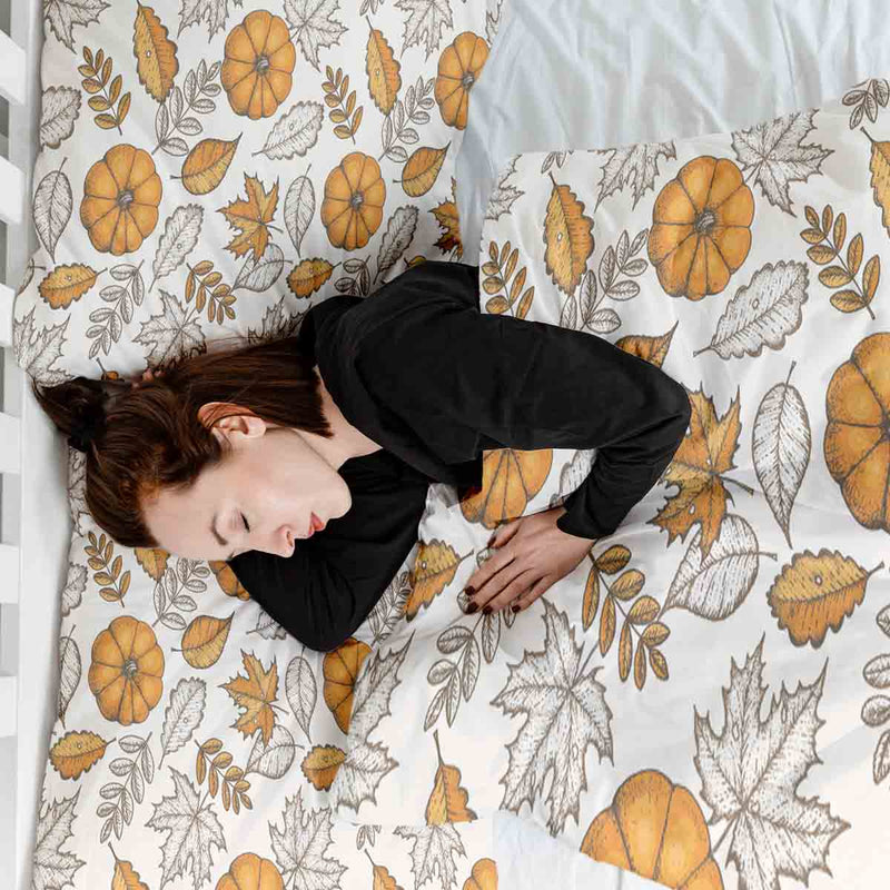 Therapy blanket bedding set, white with leaf and pumpkin pattern.